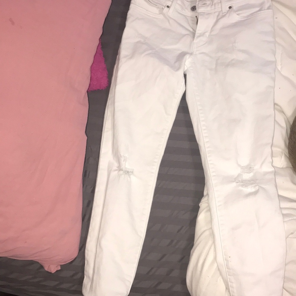 White ripped pants